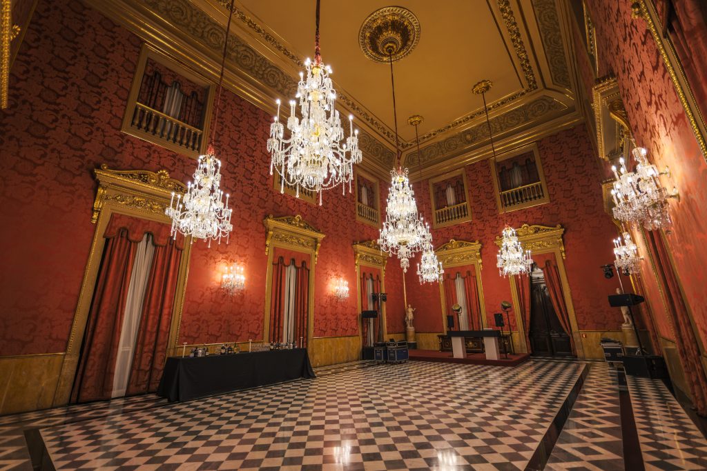 reception room with chandeliers
