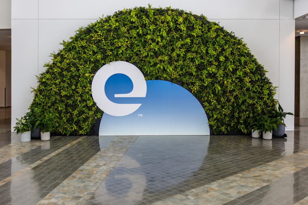 Expedia Group's logo with greenery arch
