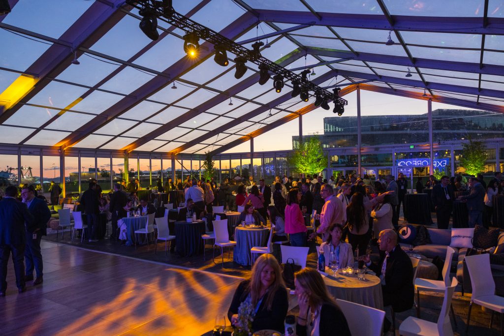 attendees in outdoor structure for evening party