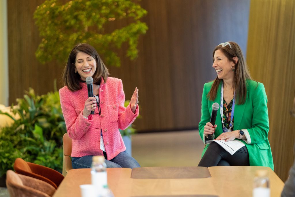 speakers smiling while presenting