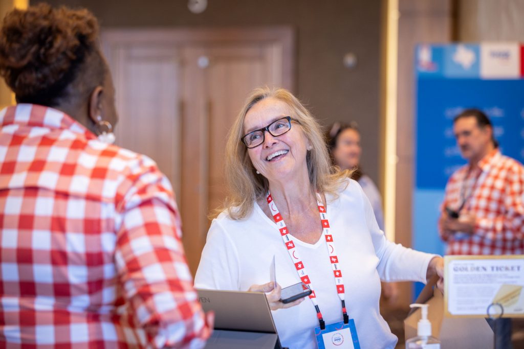 smiling attendee at registration