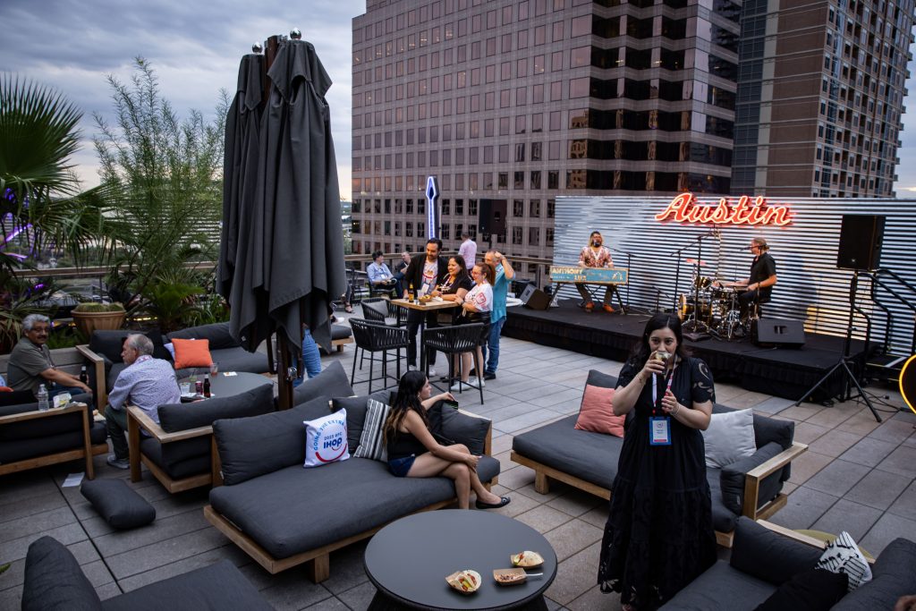 band performing on rooftop at franchise event