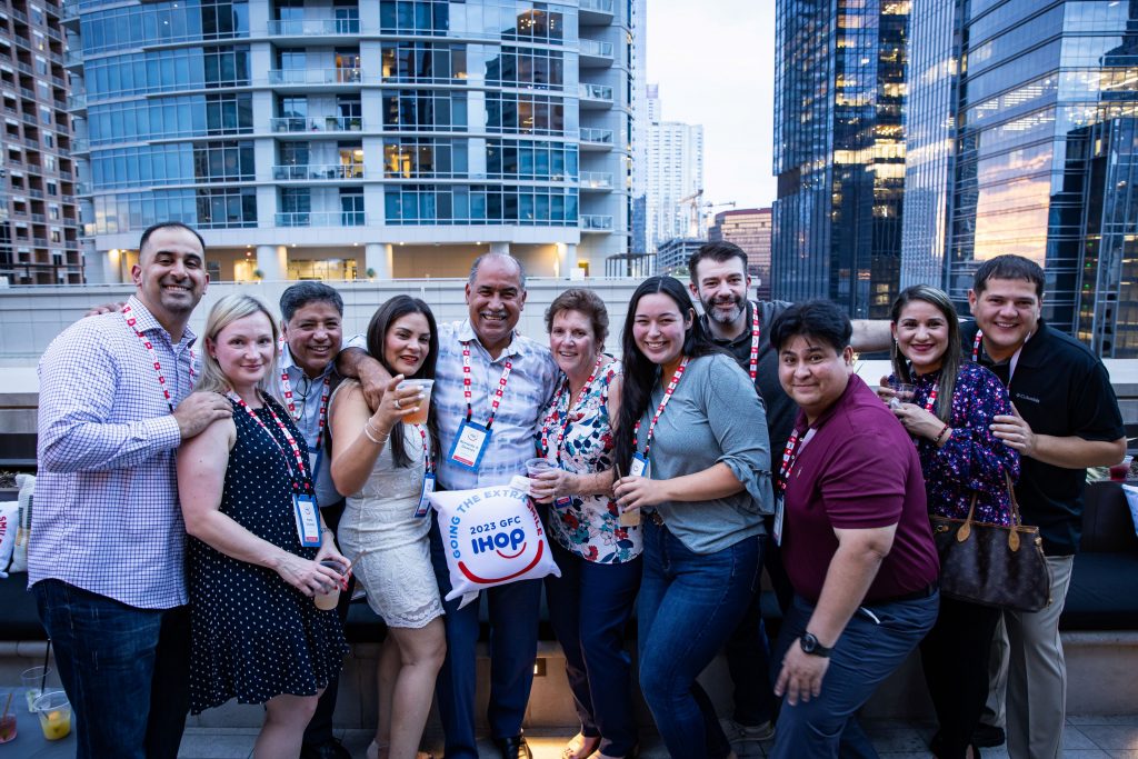 group posing for photo on rooftop