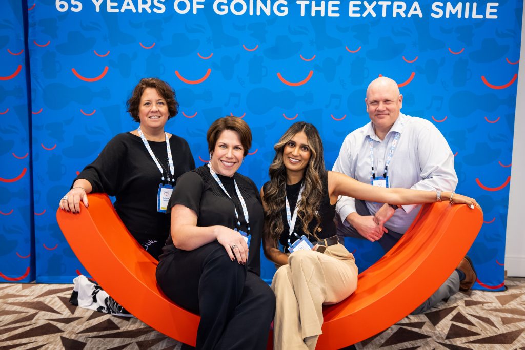 attendees smiling in photo booth