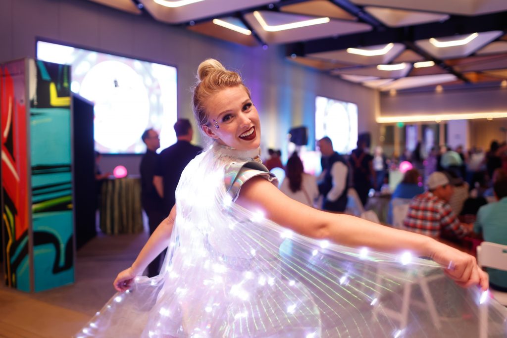 entertainer in glowing costume performing