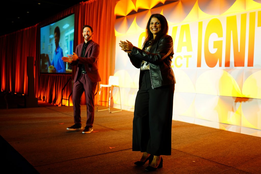 presenters clapping on stage
