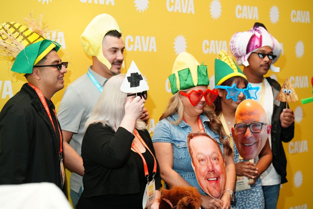 event attendees using props for photo booth
