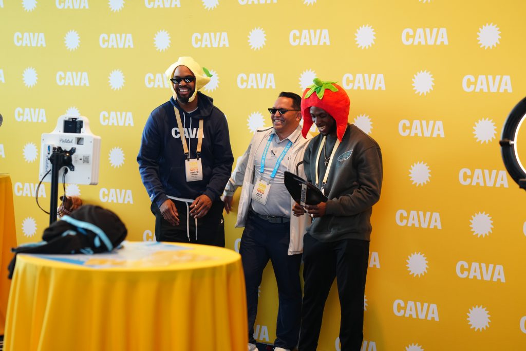 smiling attendees at event photo booth