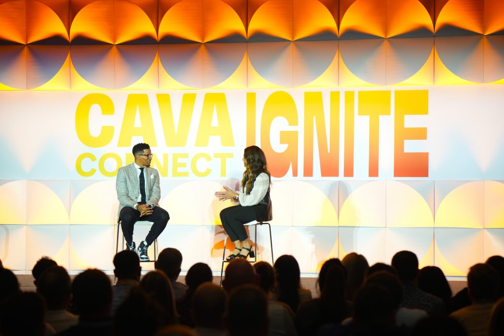 speakers on stage at corporate event