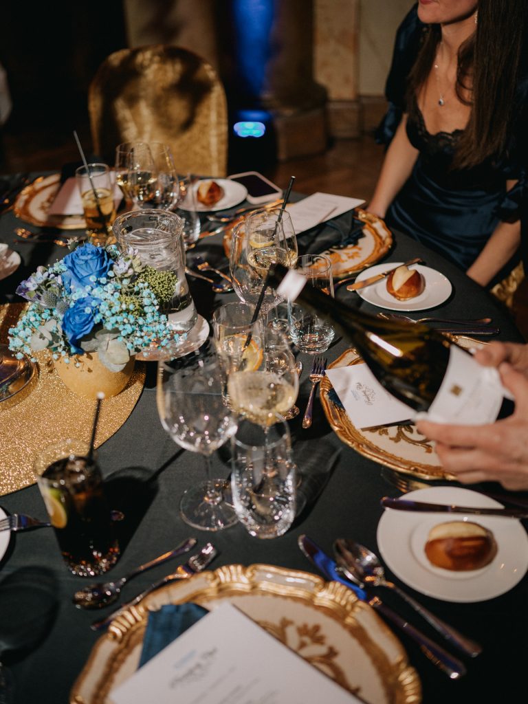 pouring attendee wine