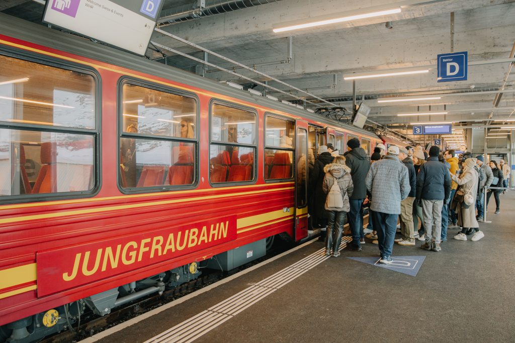 attendees boarding train in Switzerland