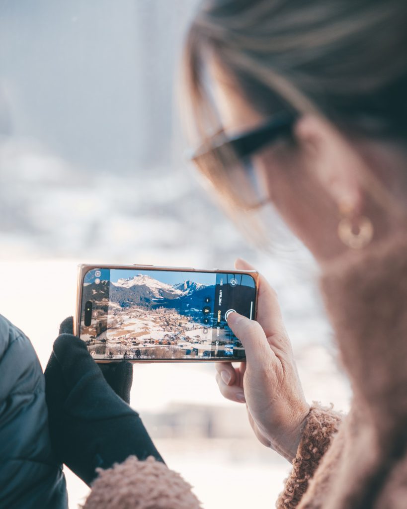 attendee taking a picture of mountains
