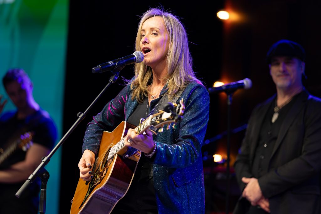 singer performing with guitar