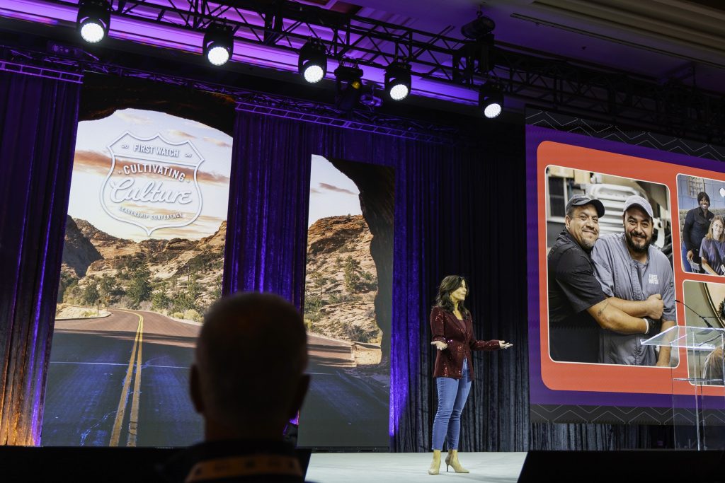 presenter on stage at leadership conference