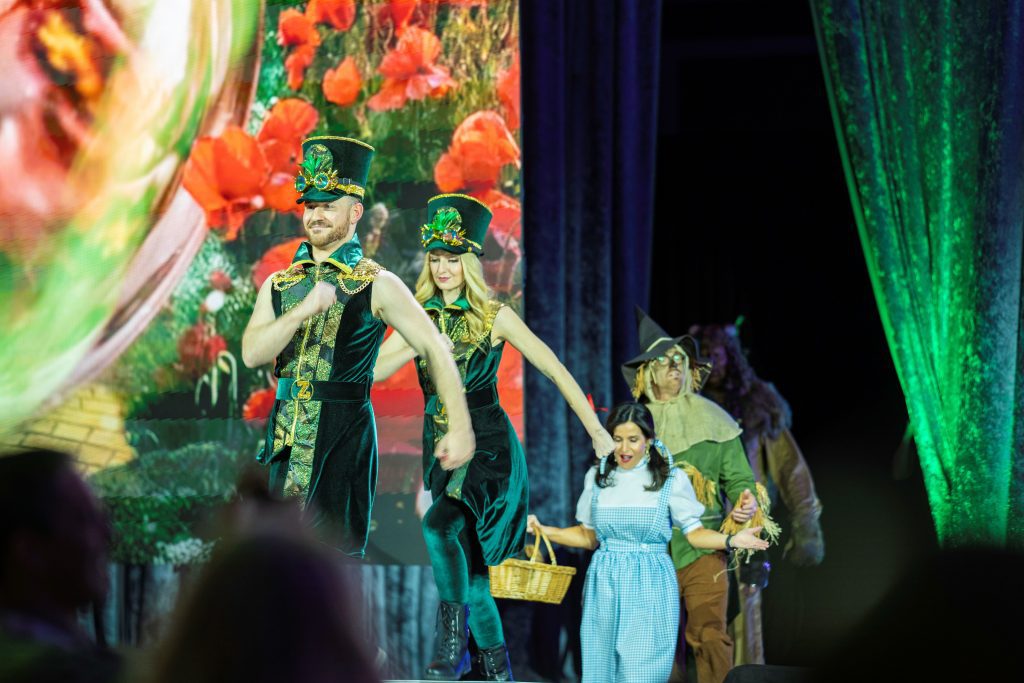 performers and executives dressed up for Wizard of Oz reveal