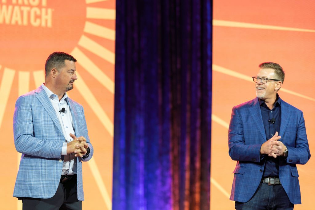 two speakers on event stage