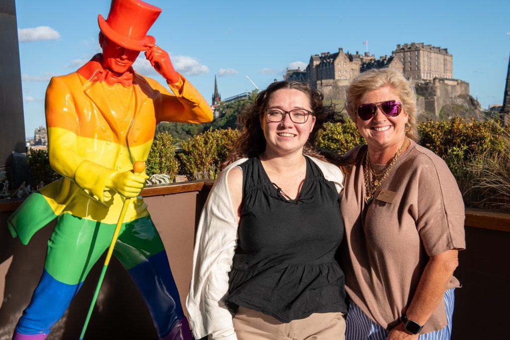 BMC staff smiling in front of Edinburgh Castle