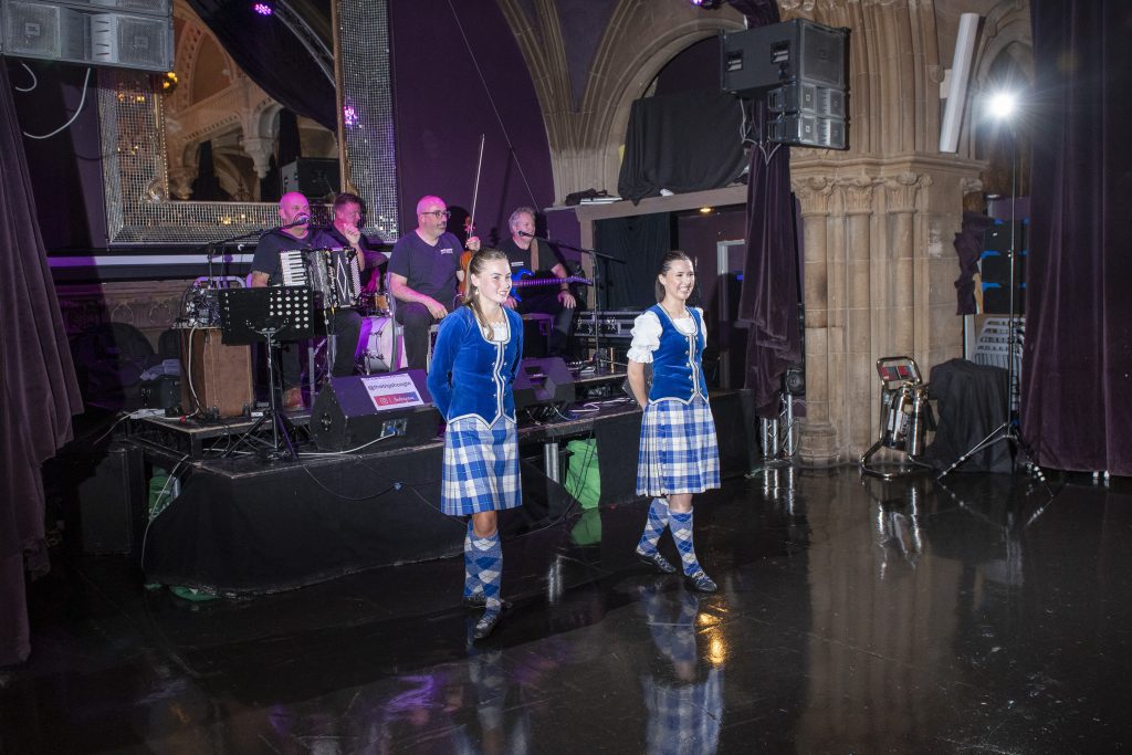 band and dancers performing during customer incentive travel