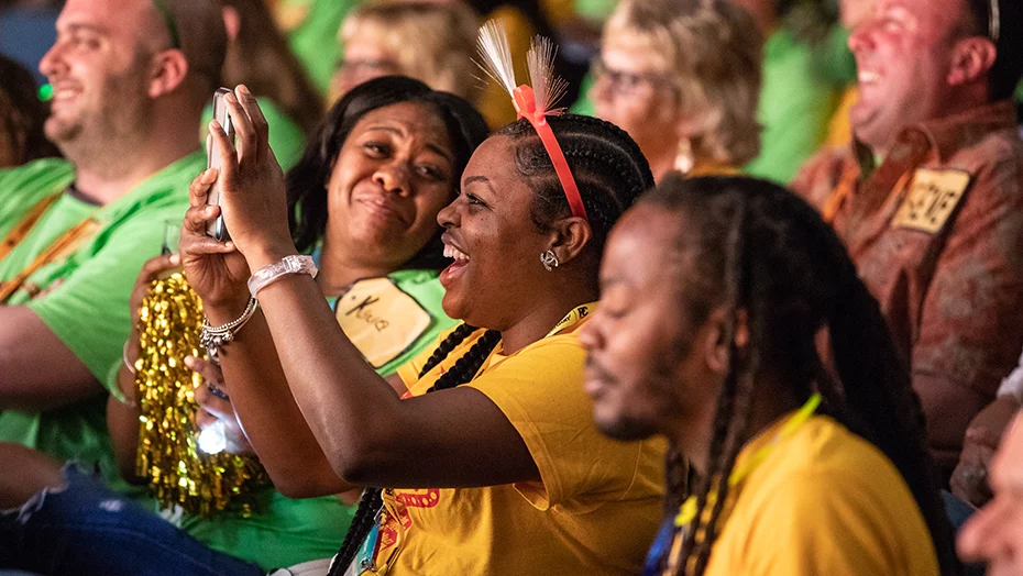 smiling attendee in a crowd